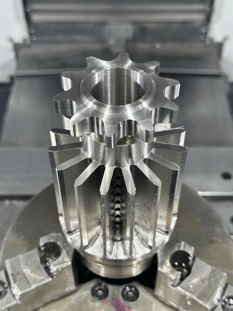 A stainless steel hub with machined cooling fins and an integral sprocket