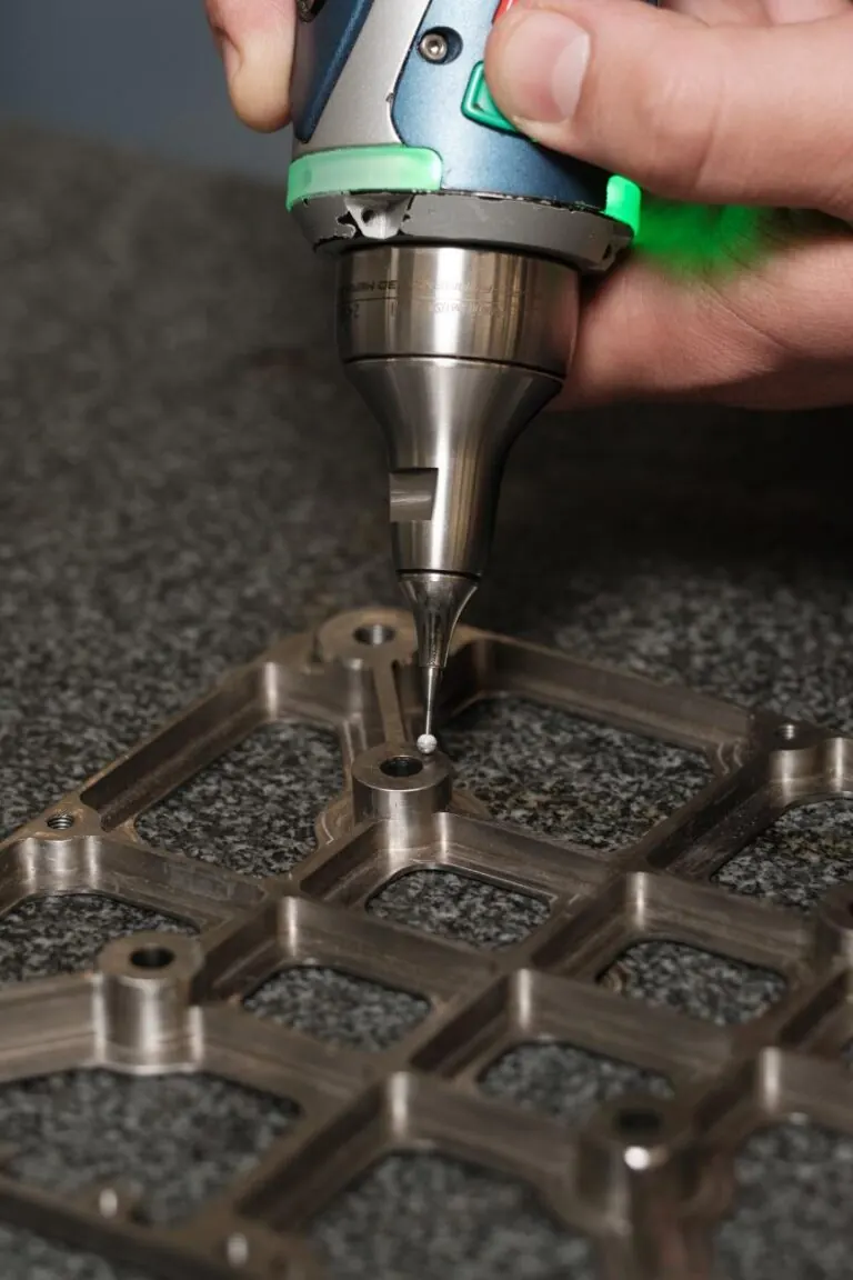 Probing a machined stainless frame on a granite surface plate
